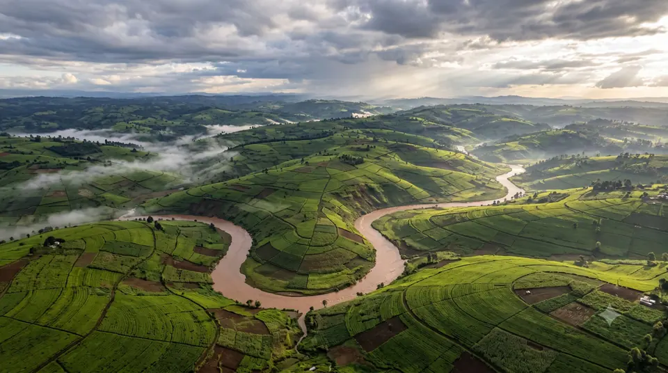 Terraced smallholder farmland along a swollen river in the Kenyan highlands
